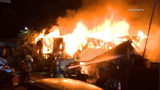 Firefighter Catches Fire at Mobile Home Fire