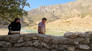 Mother and Son in Exile: Building a Stone Shelter to Survive by the Mountain River