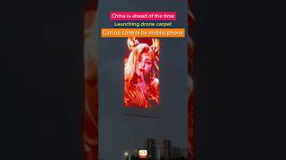 A man uses a drone to bring a curtain into the air, #dronecarpet #dronespraying #china