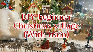 Our Beginner DIY Christmas Village (with train) Dollar Tree accents to complete our thrifted village