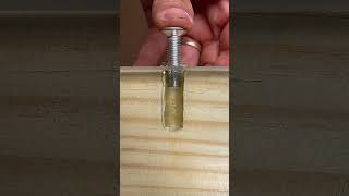 Hot glue trick to secure a wall-embedded nut. #woodworking #short