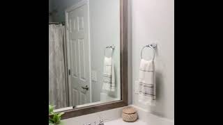 @at.home.with.hilary framing their wall-mounted mirror w/ a MirrorMate frame in Cherokee Farmhouse.