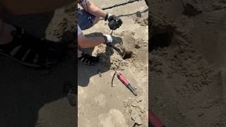 Mysterious discovery metal detecting at the beach. #metaldetecting