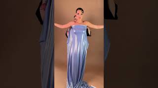 Share with a friend who would own the spotlight in this icy blue draped gown! To order, send us a DM