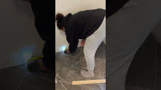 Part 7 of my entryway makeover! I grouted and re-installed the baseboards! #diyhomeprojects#tiling