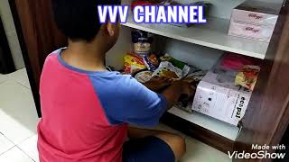 Vinayak helping to arrange the pantry!